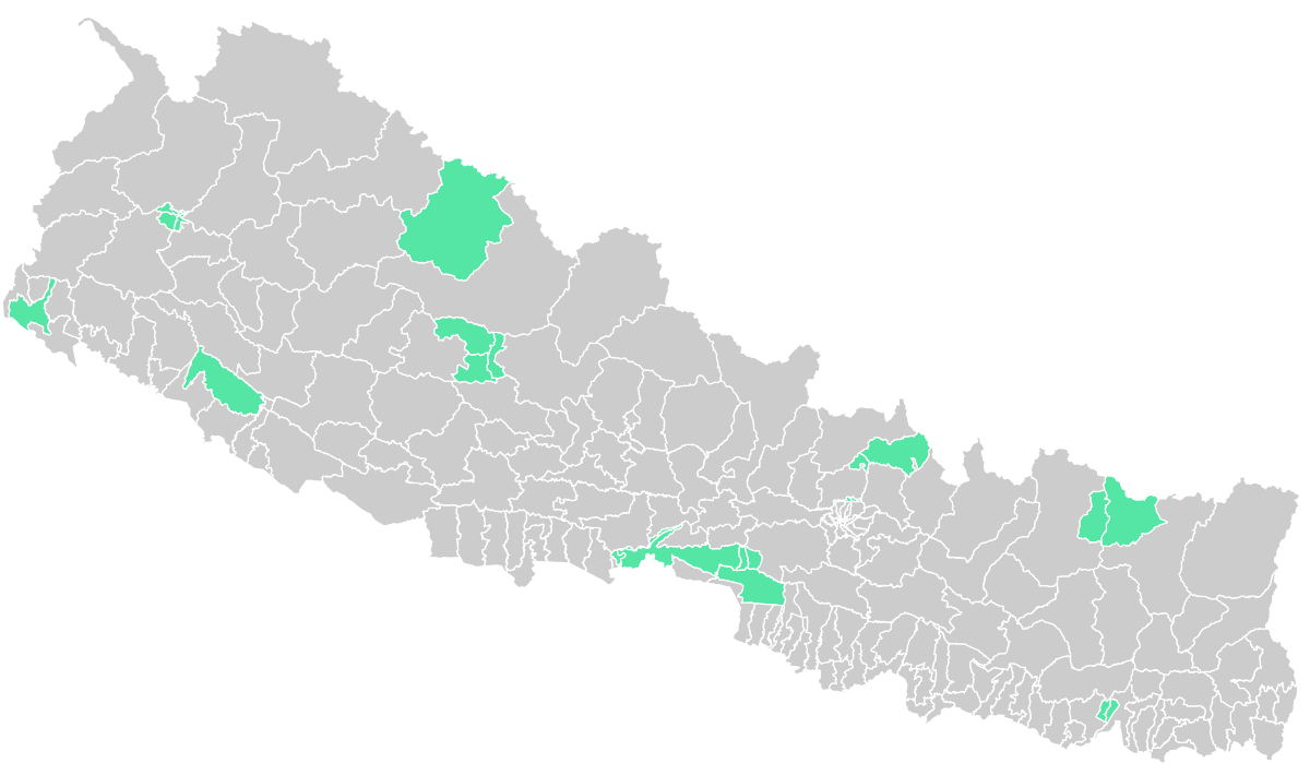 Map of Nepal's electoral constituencies in grey with national parks highlighted in green.